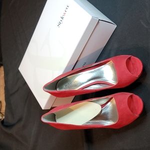 Style and company. Cherry red peep toe pumps. 7.5 Like New Condition.